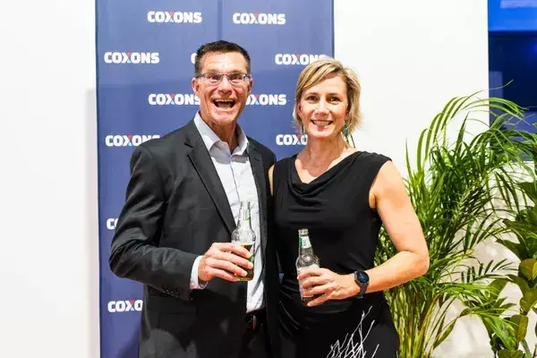 Colleagues talking at a company event